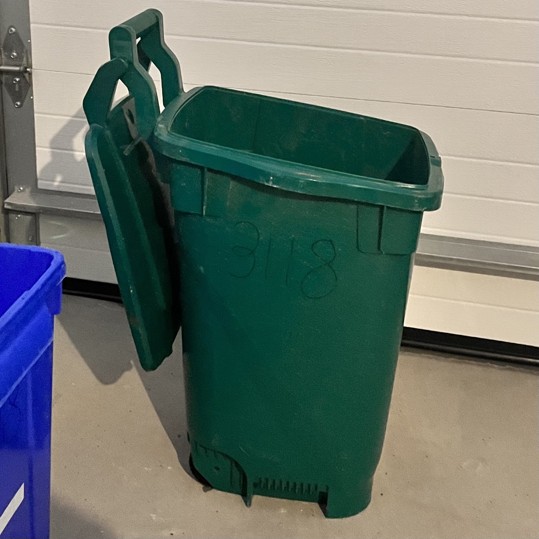 The sound of a person dragging the bin.