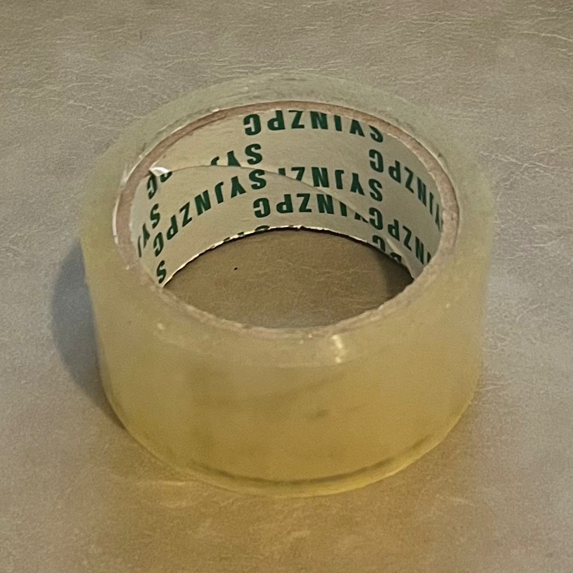 The tape is lying down, both the inside and outside is visible.